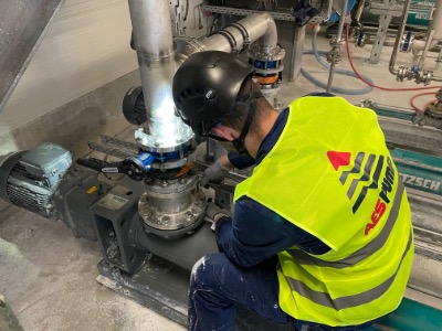 man repairing a pump