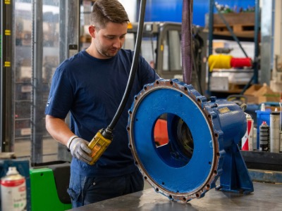 man working on a pump